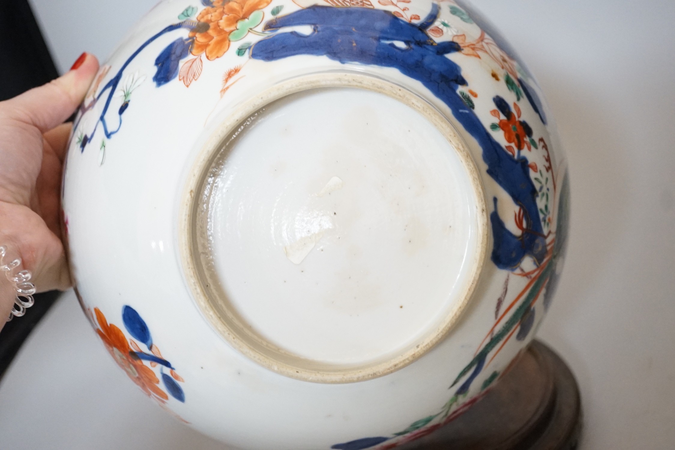 An 18th century Chinese famille rose bowl on wood stand, c.1740, diameter 26cm